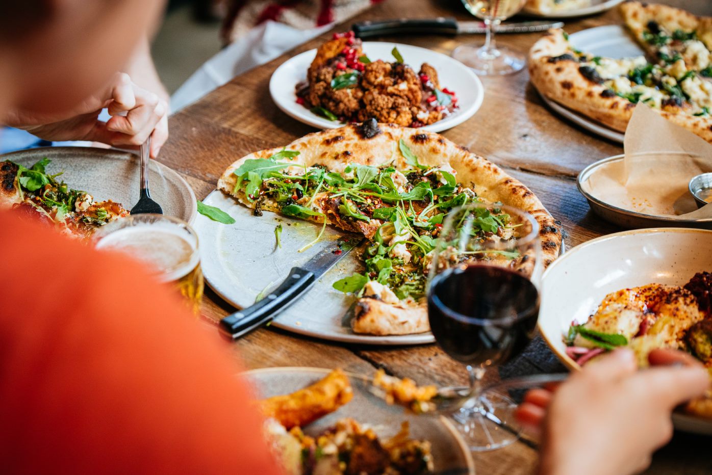 Pizza and wine at Caravan City restaurant | Bloomberg Arcade