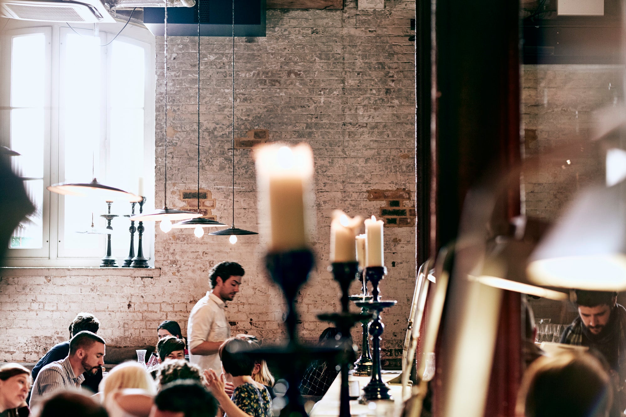 Dining room and candles at Caravan King's Cross restaurant