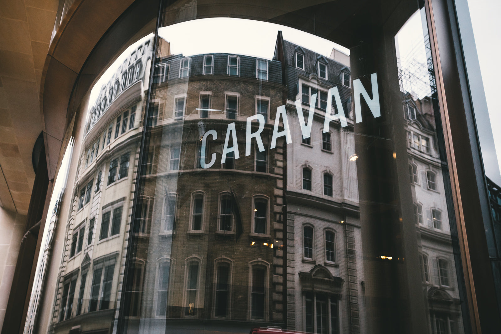 Exterior window picture of Caravan City restaurant | Bloomberg Arcade