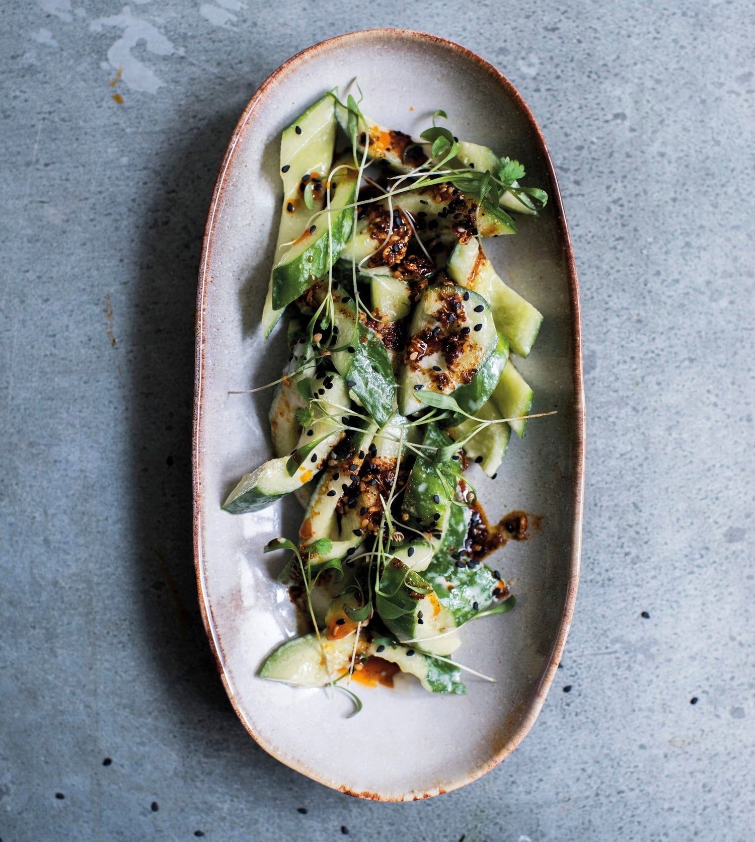 Caravan Recipe: Smashed cucumbers, sichuan chilli oil, sesame-soy dressing